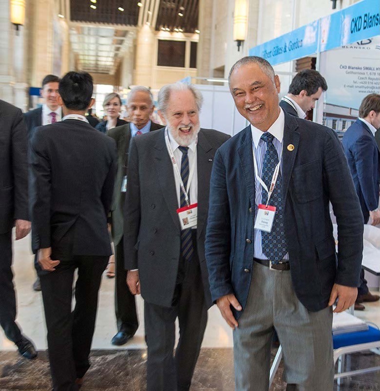 Lord David Puttnam touring the Exhibition, along with Vice Minister H.E. Viraponh Viravong